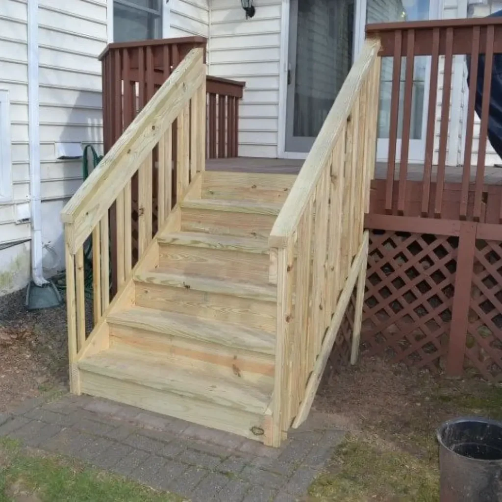 a wooden stairs outside a house