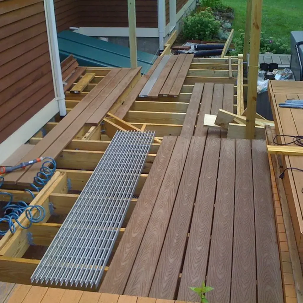 a deck being built with wood and metal grate