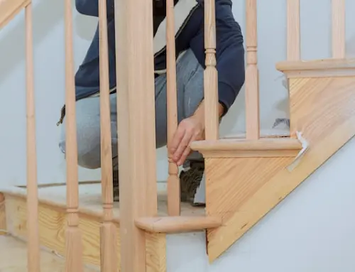 a person installing railing on stairs