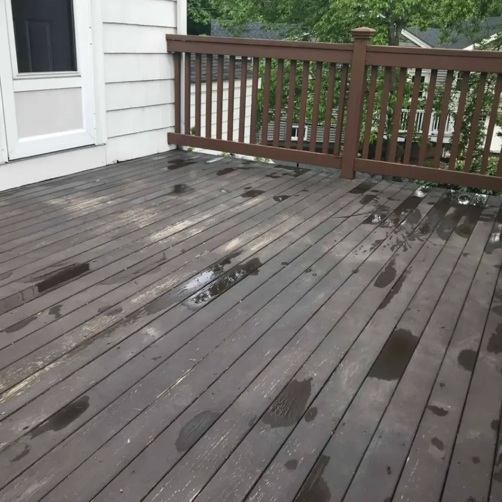 a wet deck with a railing