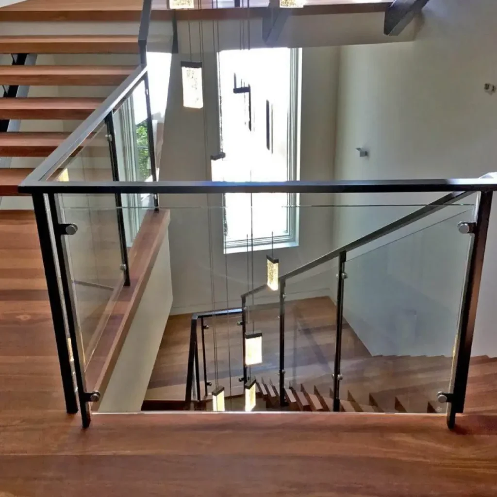 a staircase with glass railings