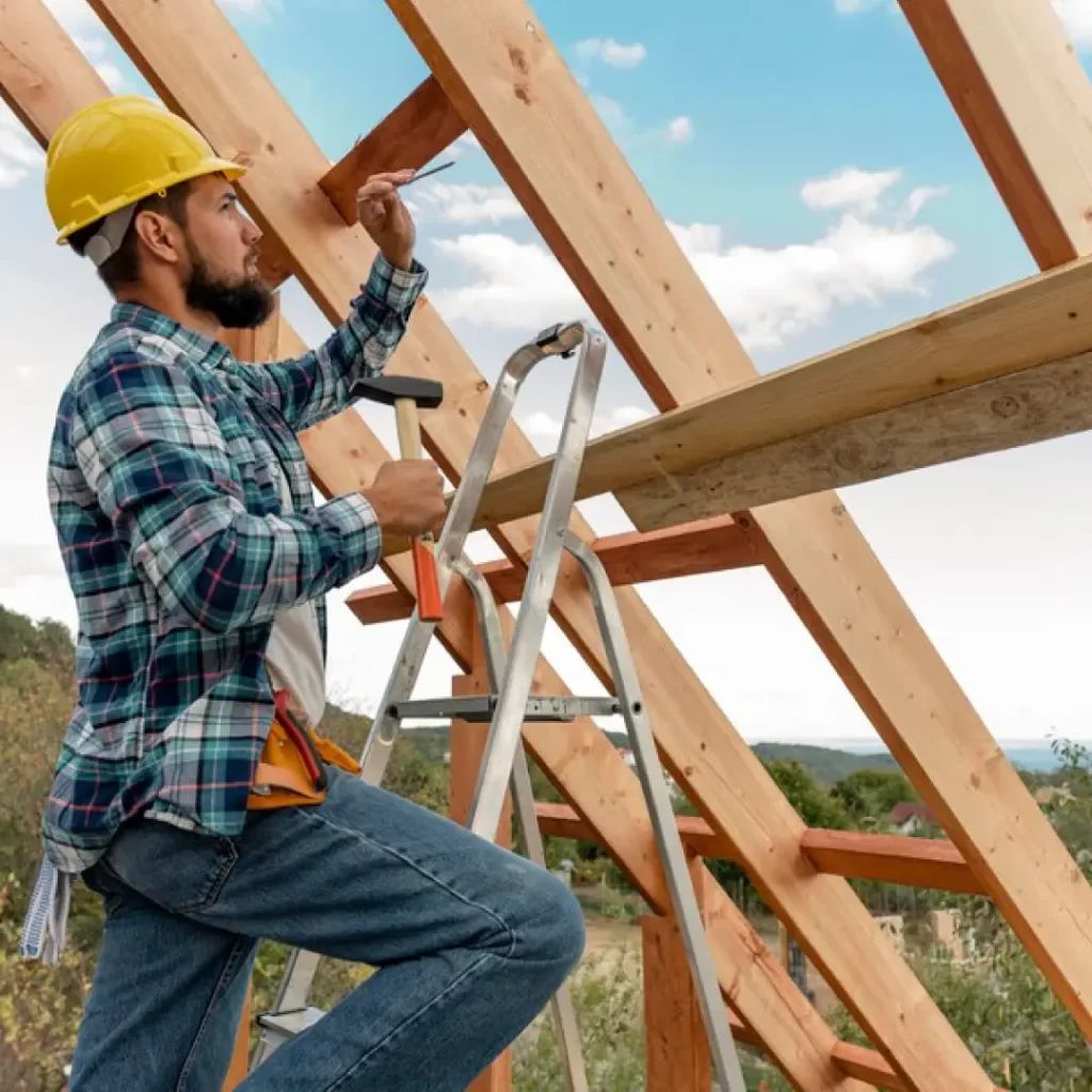 a person on a ladder working on a roof